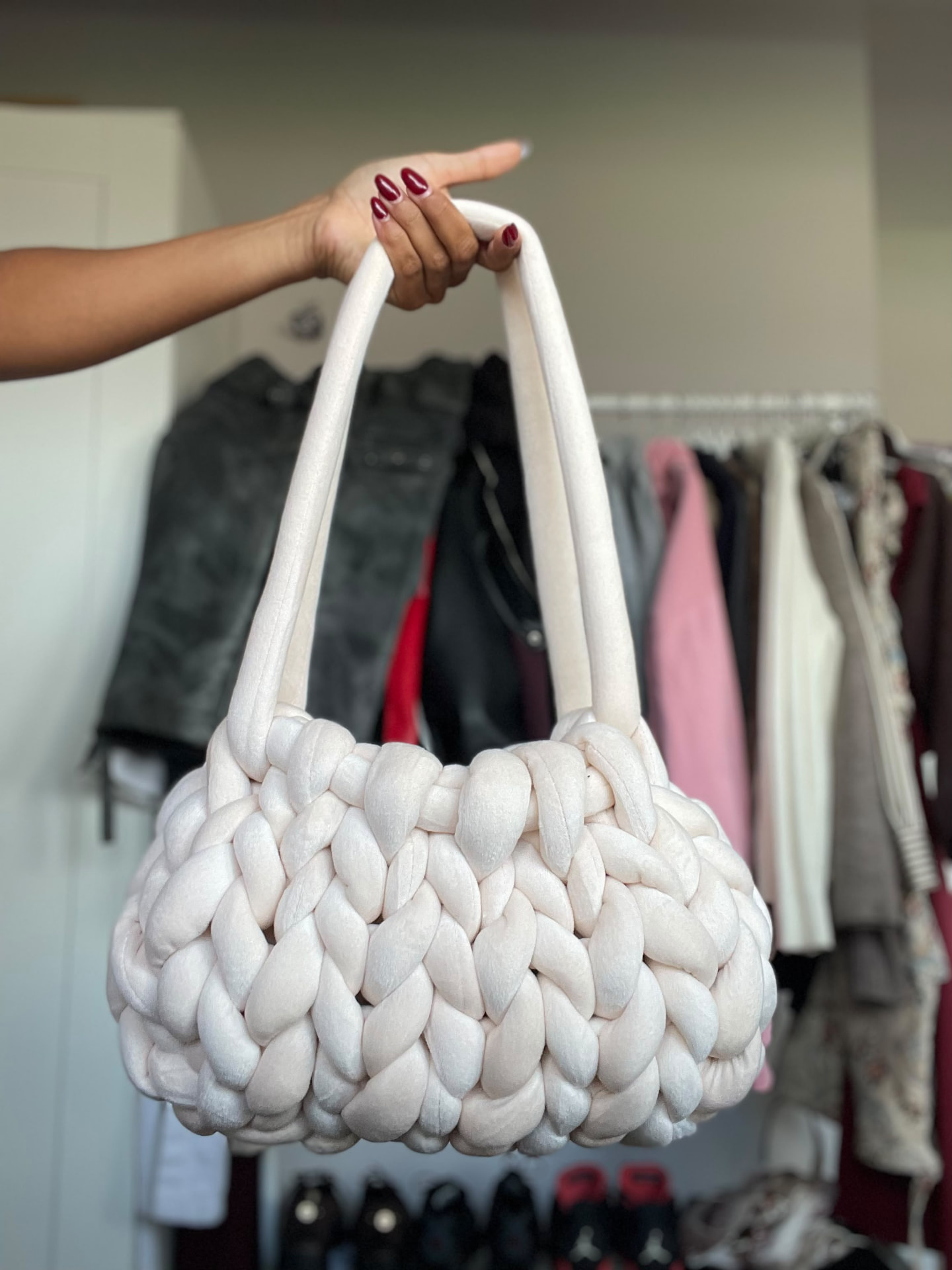 Cream Cloud Tote held by its padded handles